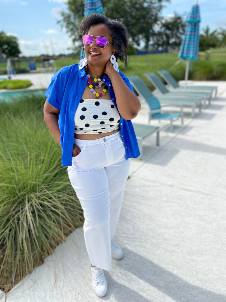 J. Crew Factory for Summer | over 40 woman in a short sleeved blue shirt open over a polka dot tube top and white jeans